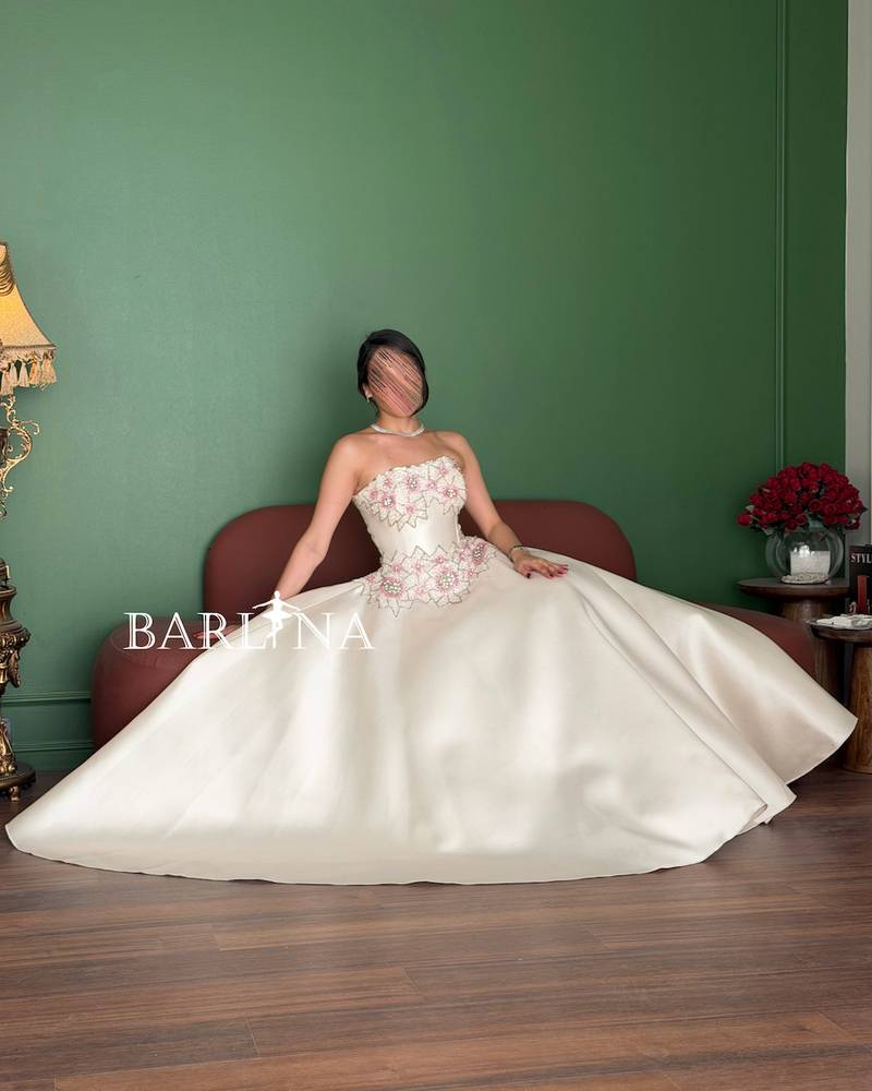 Off-white dress with a pearl-embroidered bodice