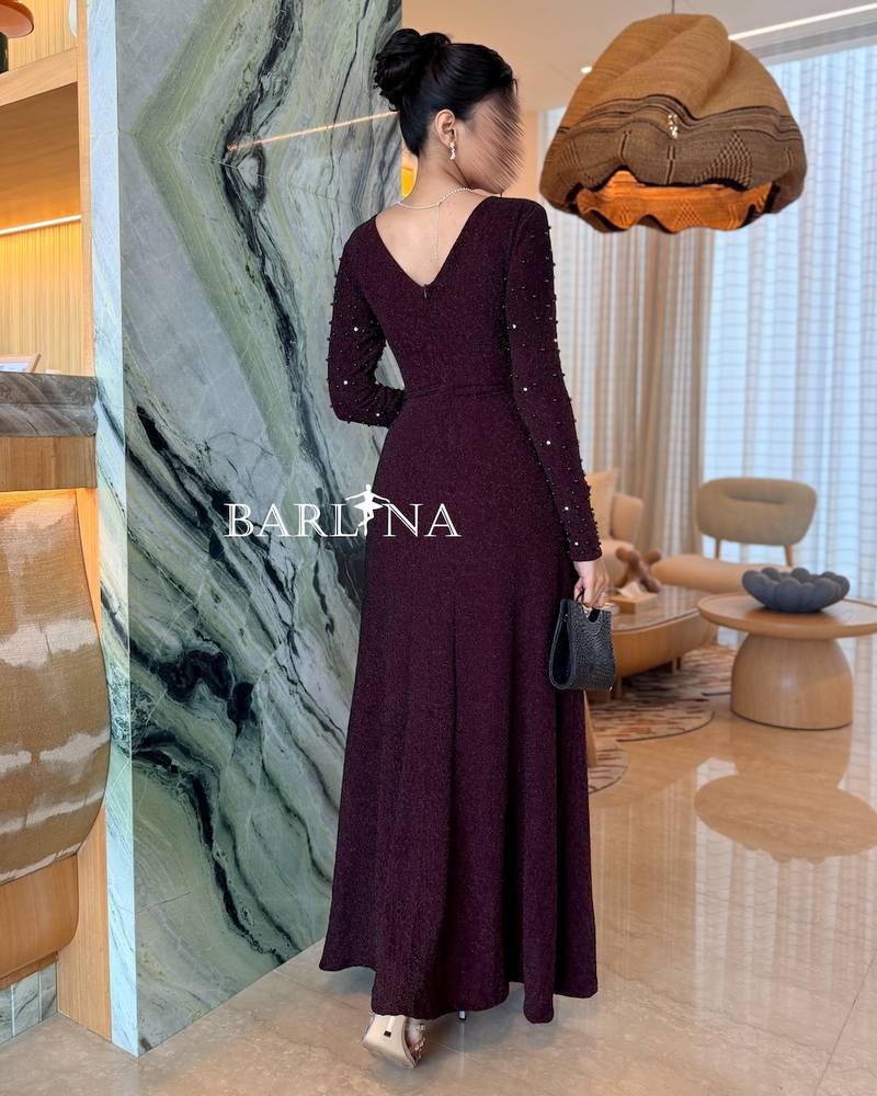 Burgundy dress with a square neckline adorned with pleats