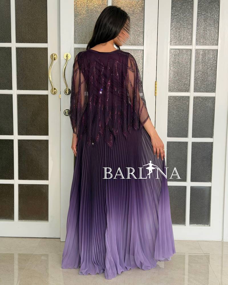 Long dress in a purple gradient with a pleated design
