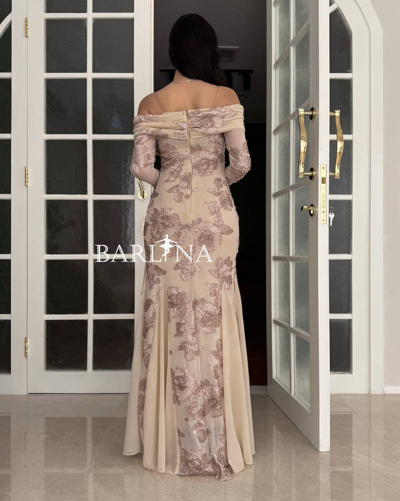 Elegant beige dress with delicate embroidery and a floral pattern
