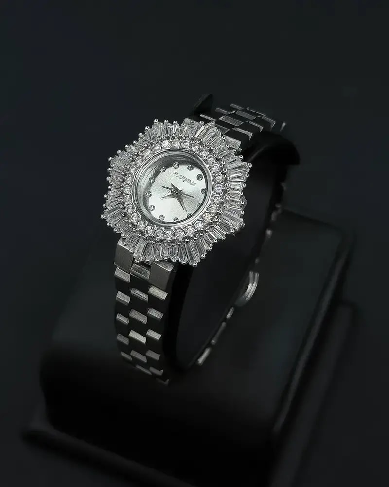 Elegant women's watch with a round studded bezel