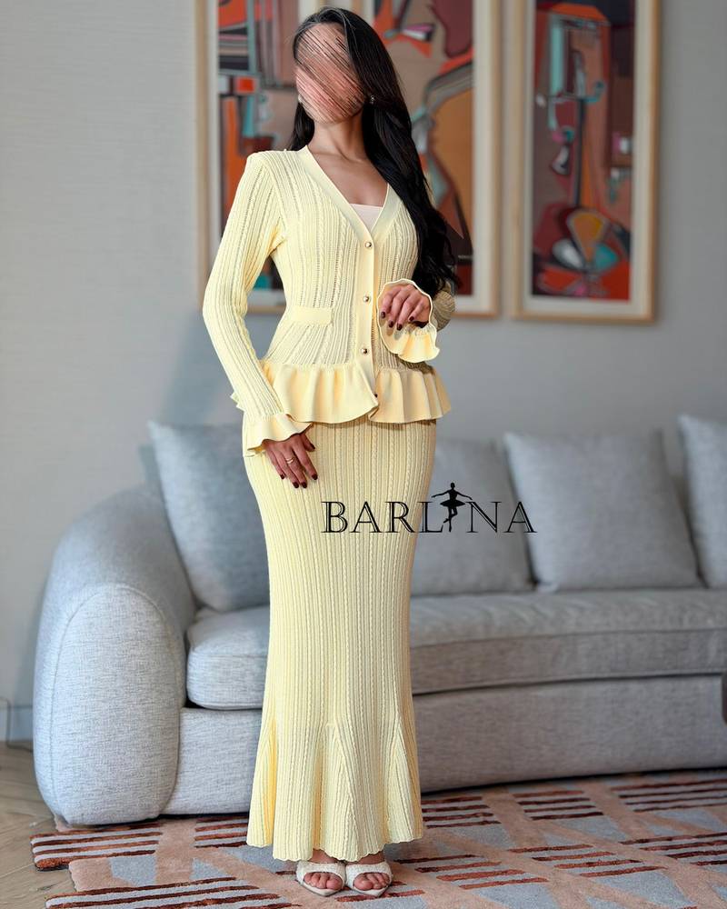 Yellow knitted dress with subtle pleats at the waist