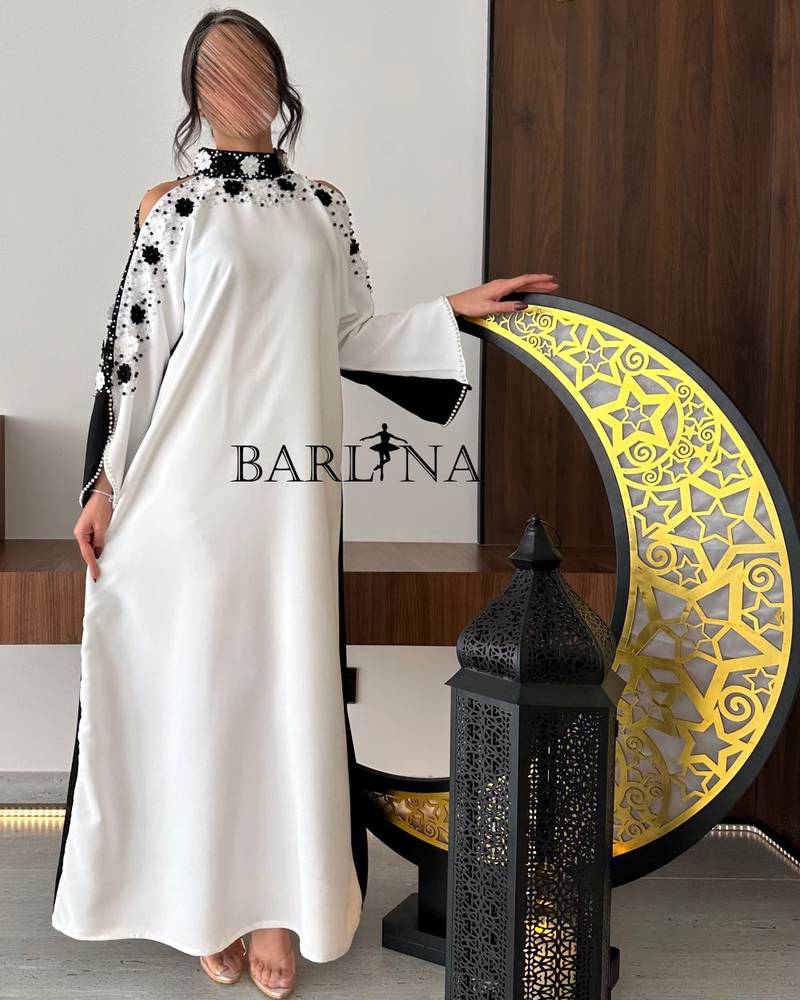 Black and white jalabiya with embroidery on the sleeves