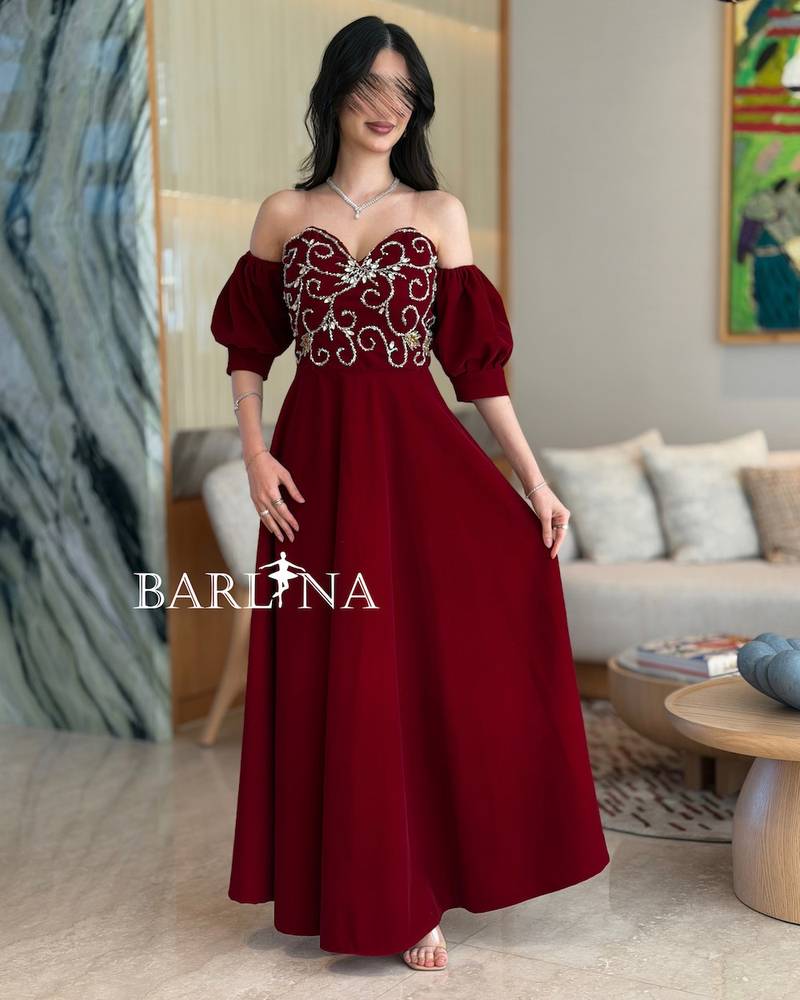 Burgundy dress with silver embroidery on the bodice