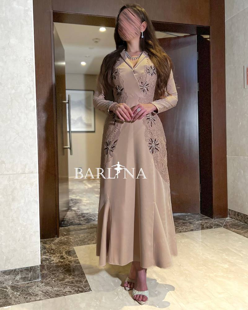 Beige dress with elegant side embroidery
