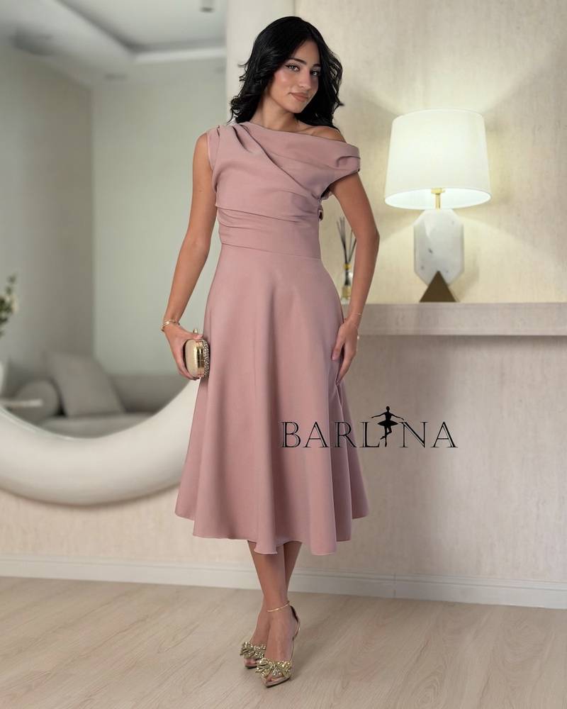 A pink midi dress with an elegant and soft design.