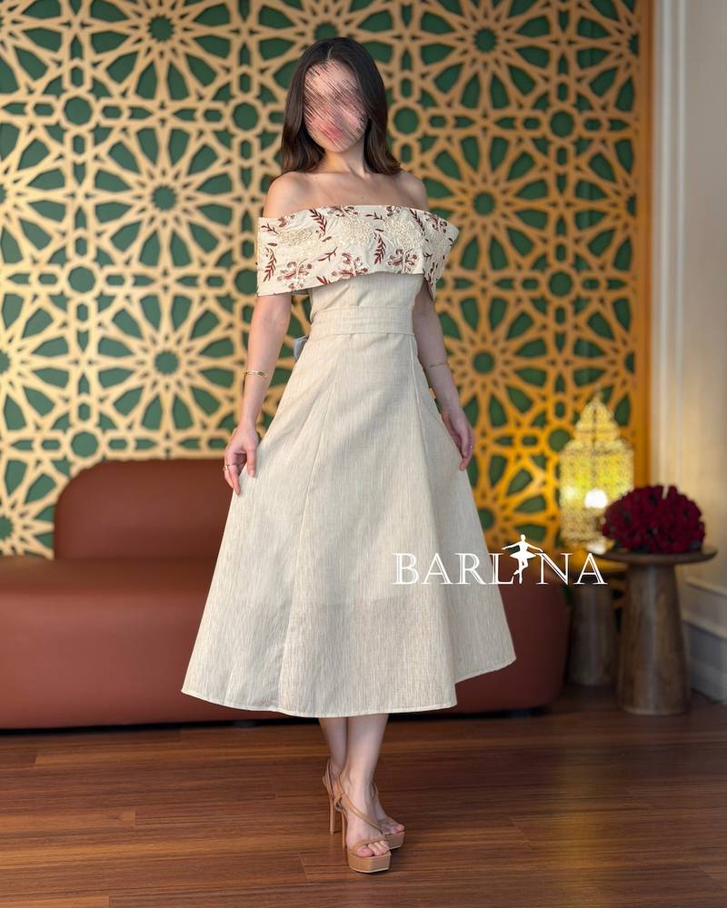 Beige off-shoulder dress with delicate embroidery