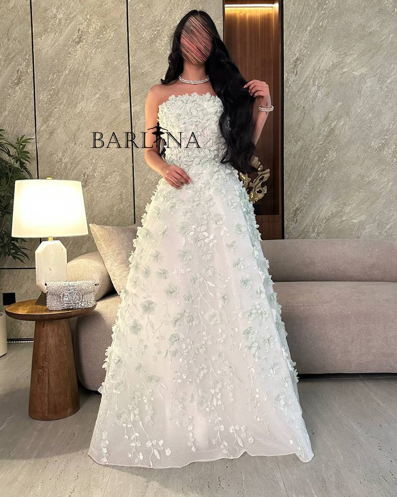 White dress with prominent rose embroidery