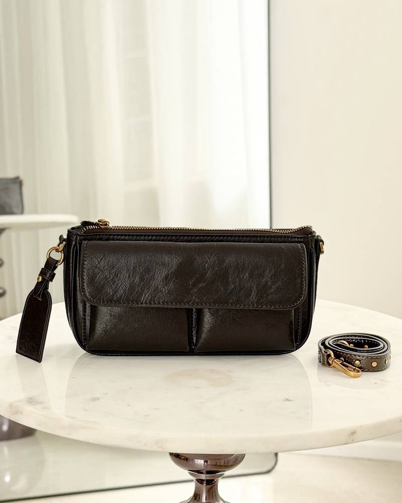 A soft handbag with a practical design and front pockets.