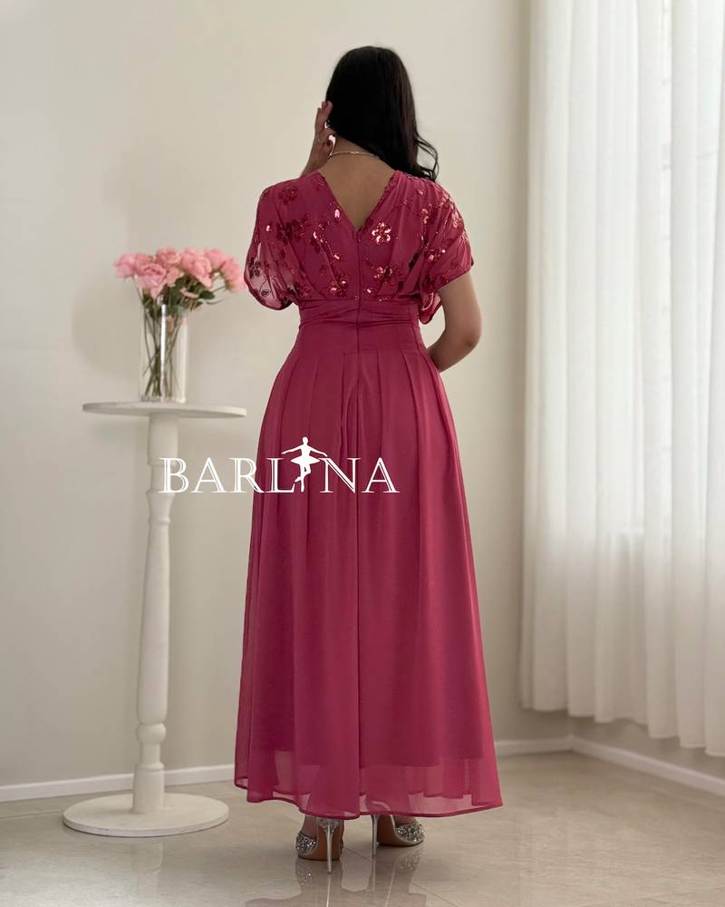 Fuchsia pleated dress with sequined roses