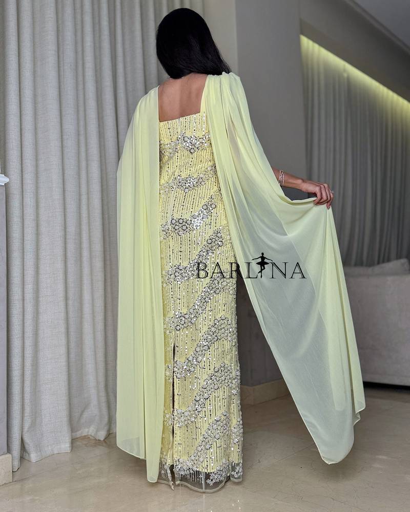 Yellow dress with shiny embroidery and a long shawl