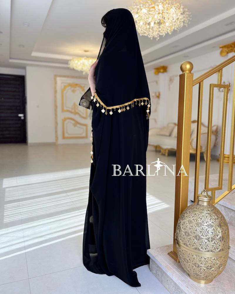 Luxurious jalabiya with gold embroidery and a shawl
