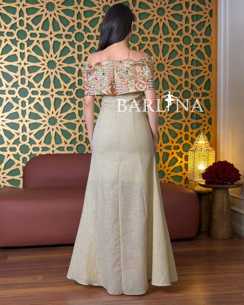Beige off-shoulder dress with colorful heritage embroidery