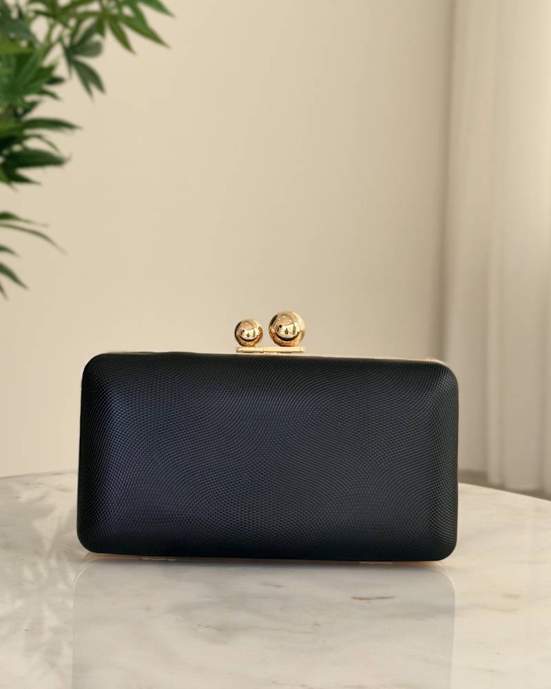 Elegant black clutch bag with a soft texture