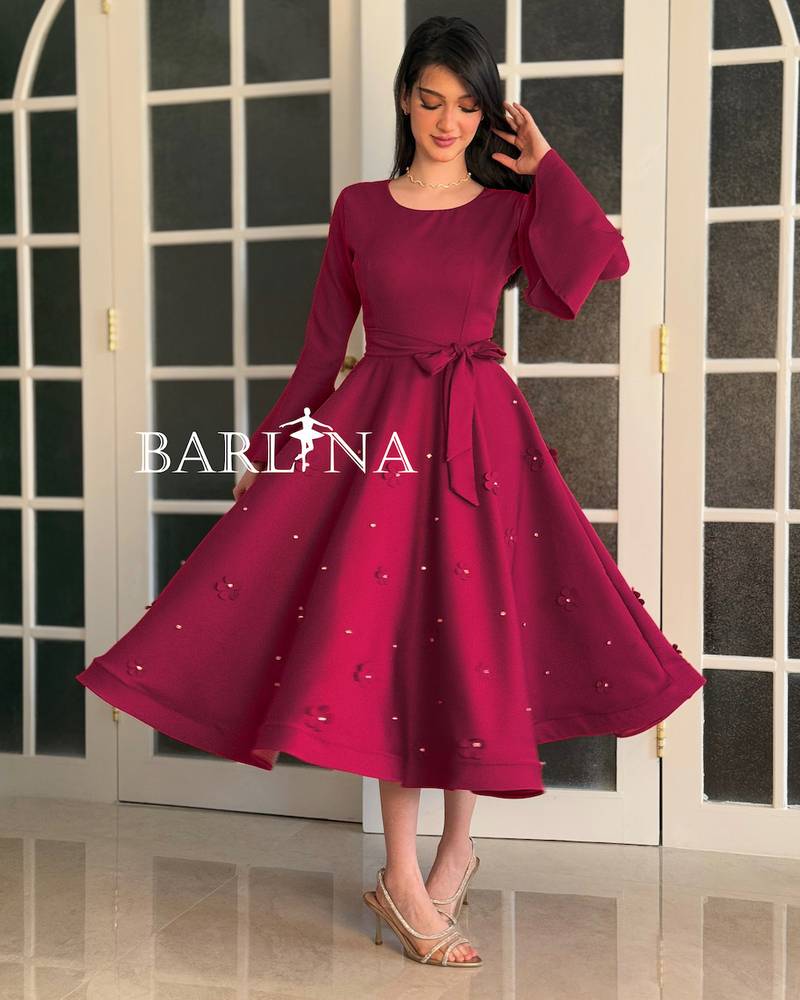 A stylish fuchsia dress with delicate embroidery