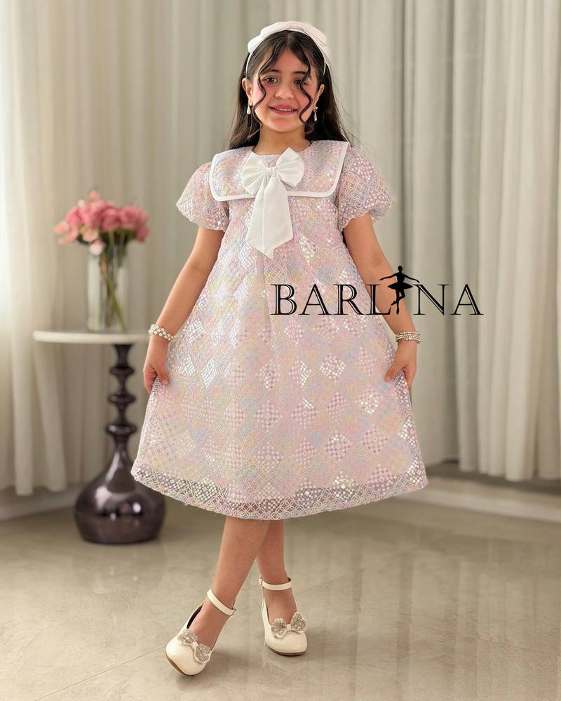 Pink girl's dress with a bow-decorated collar