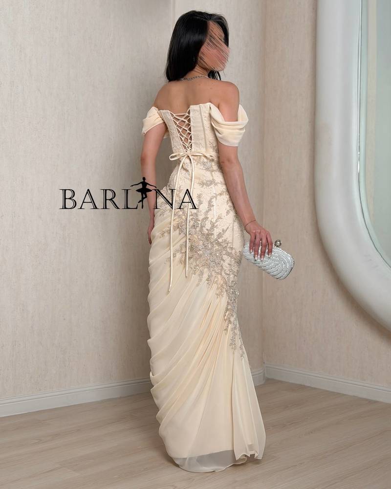 Creamy corset evening dress with draped silhouette