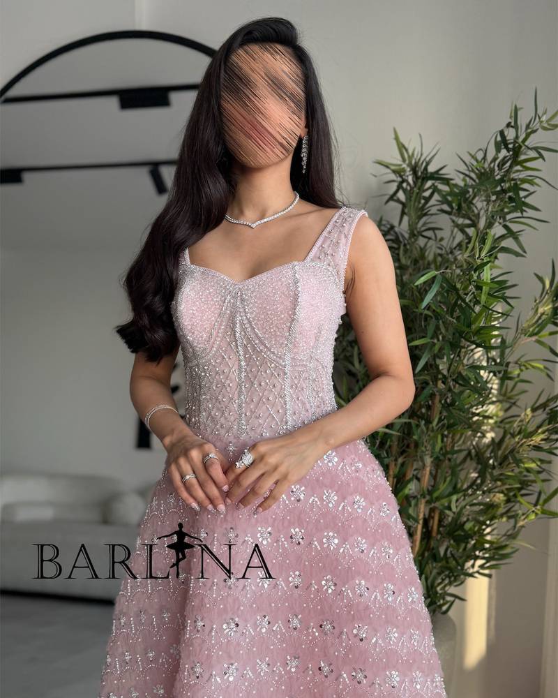 Pink dress embroidered with shimmering silver details