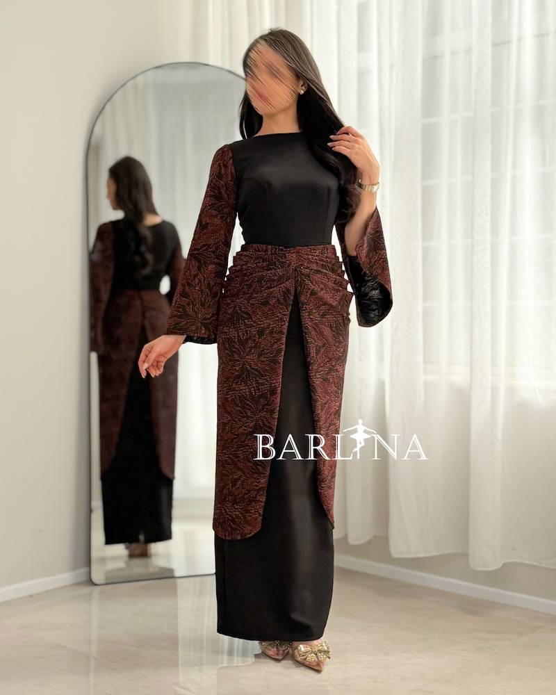 Black dress with a burgundy pattern on the sleeves and waist