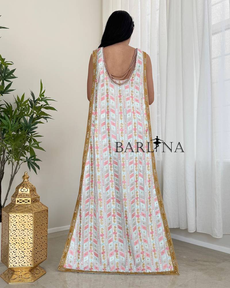 A soft white jalabiya with a gold embroidered belt