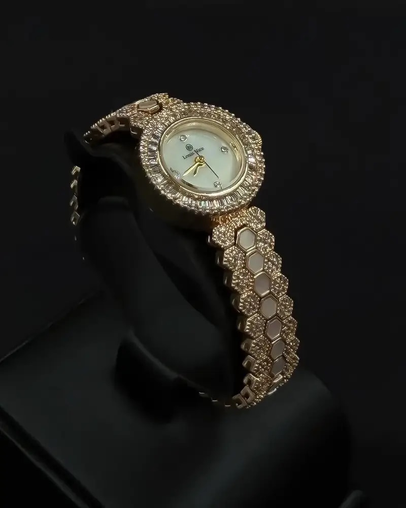 A luxurious women's watch adorned with sparkling stones
