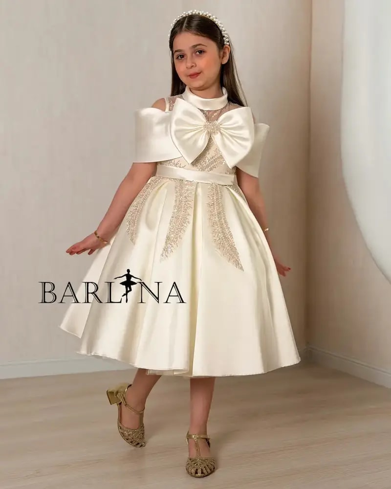 Beige girls' dress with a luxurious design and elegant embroidery