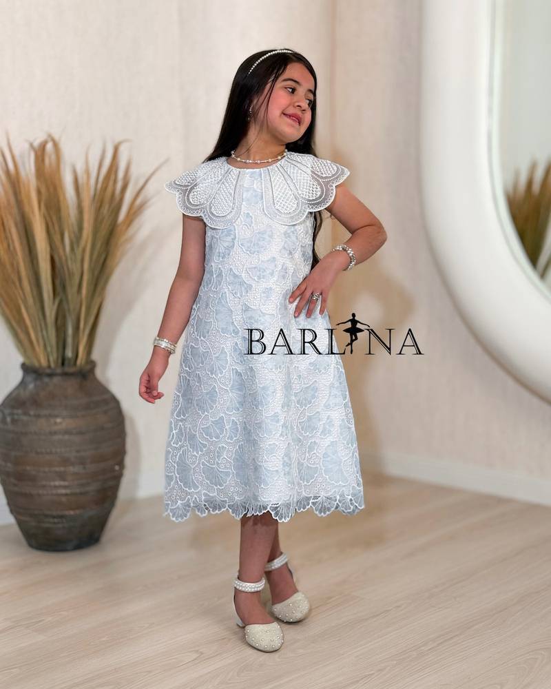 Elegant white girls' dress with a wide cut