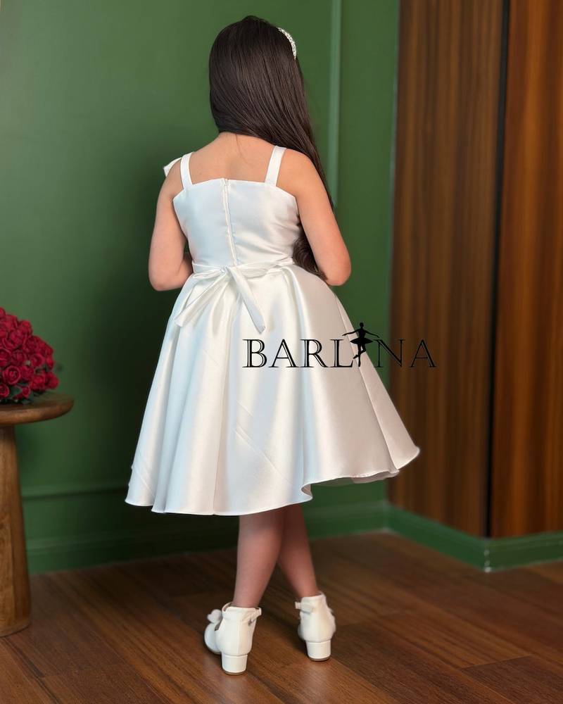 white puffy girl's dress with a rose detail