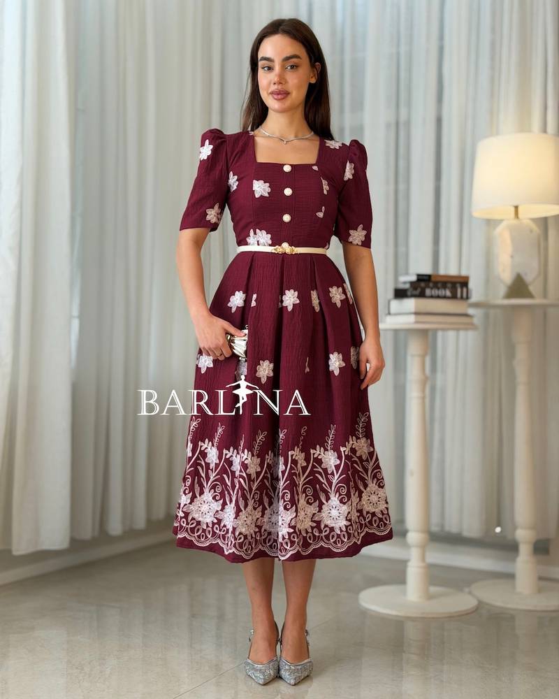 Burgundy midi dress adorned with white embroidery