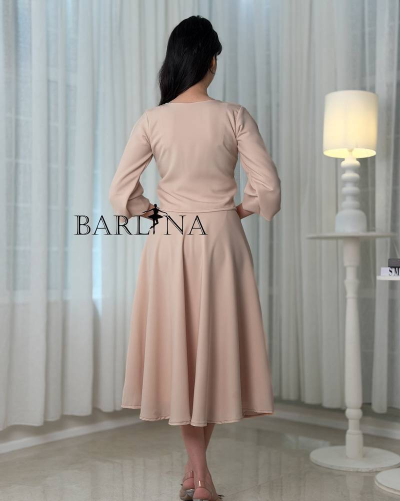 A beige set adorned with scattered shimmering embroidery