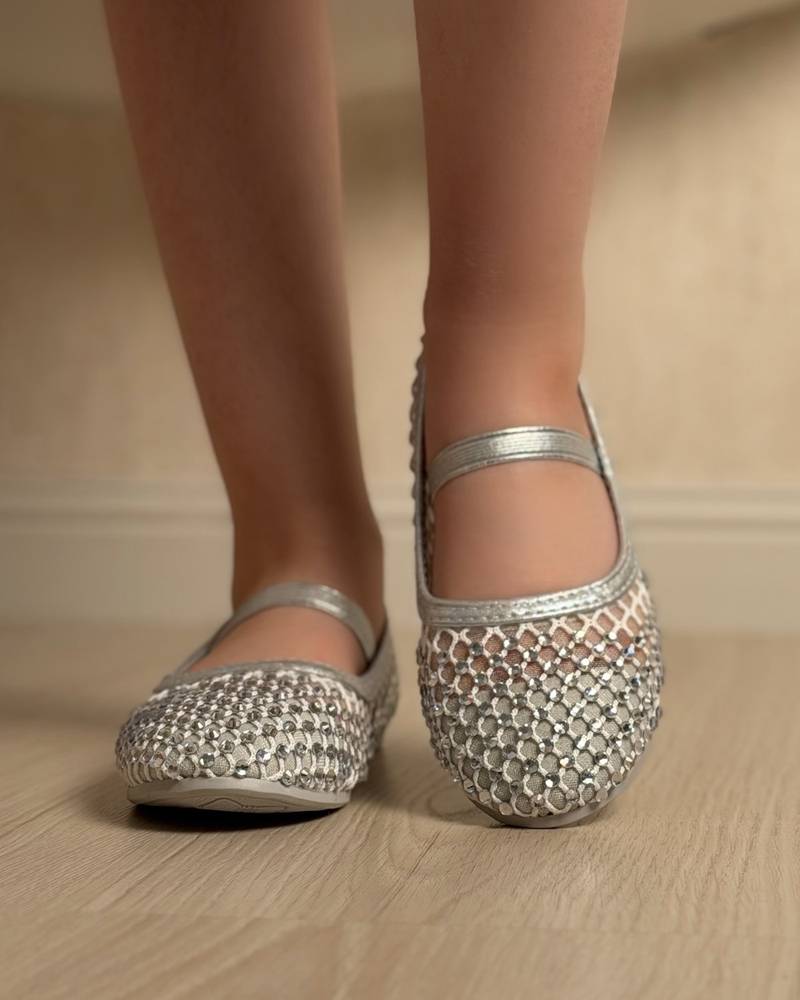 Soft girls' shoes adorned with sparkling crystals