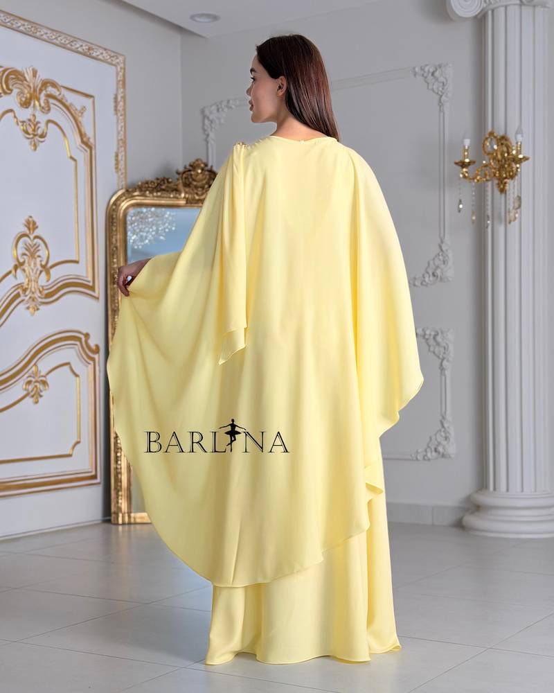 Soft yellow dress with a wide cape