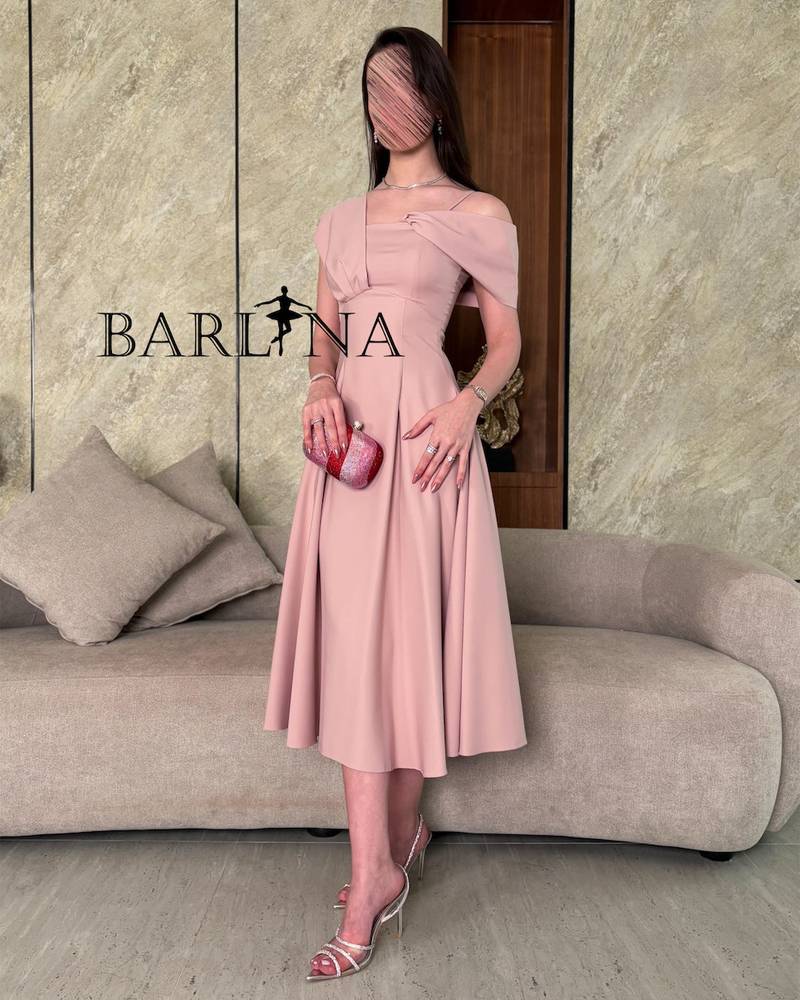 Light pink midi dress with a defined waist