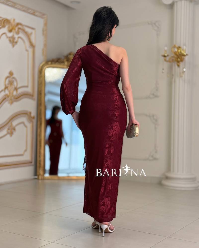 A soft, fitted dress adorned with elegant metallic details.