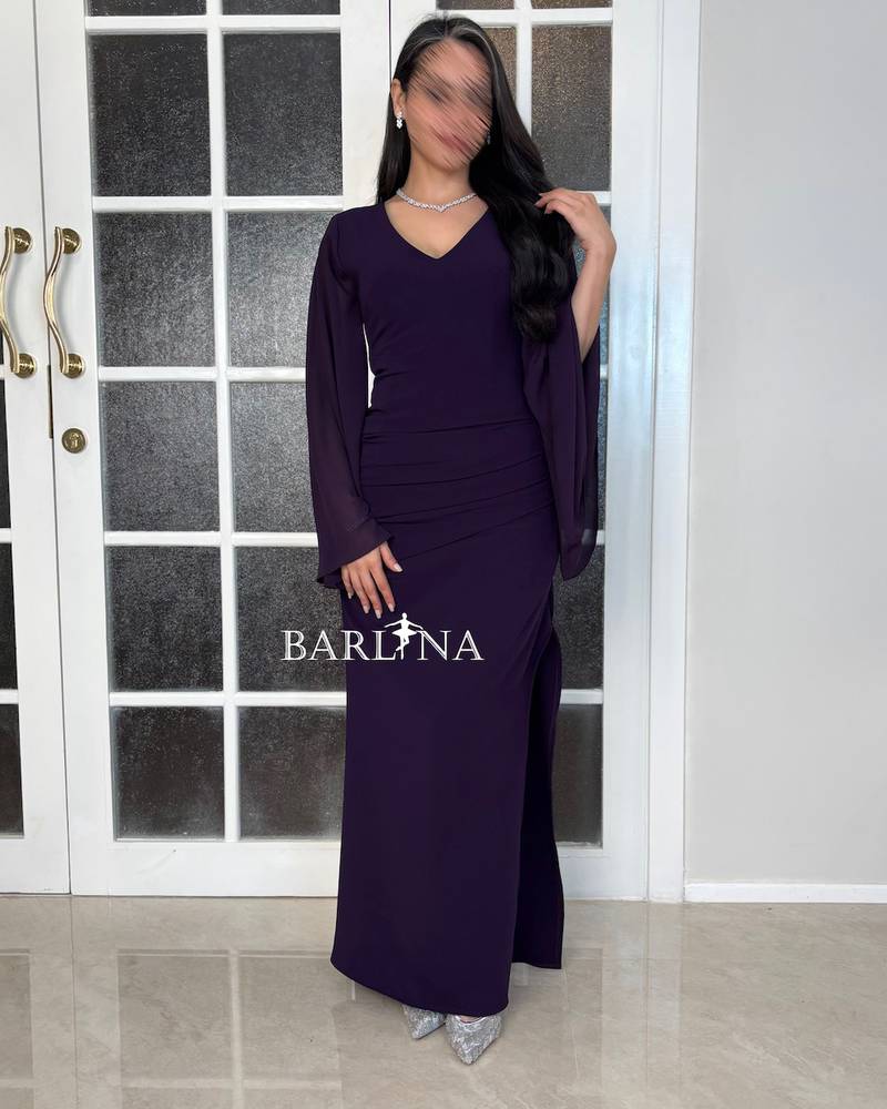 A soft purple dress with delicate side pleats