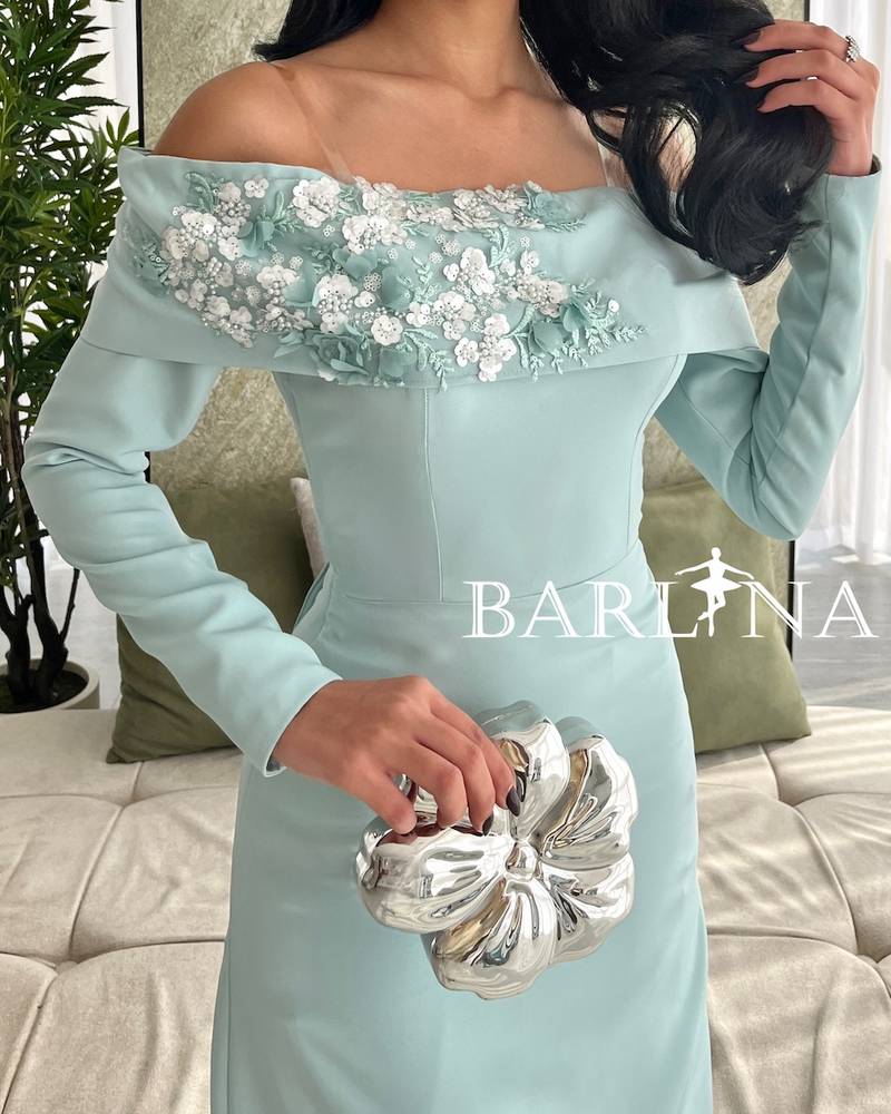 Light Tiffany dress with floral detail on the chest