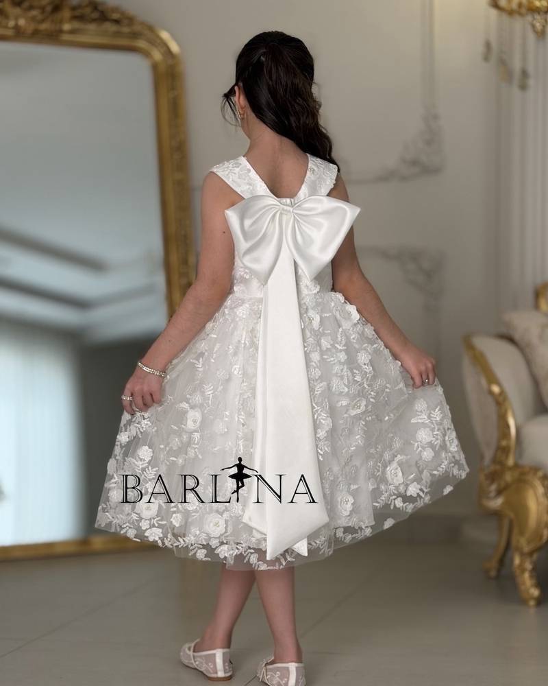 Soft white girls' dress with a cross-neck