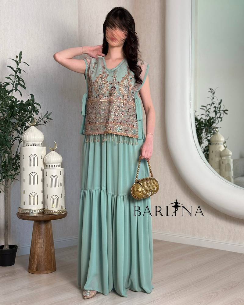 A luxurious jalabiya with an embroidered layer and a traditional touch.