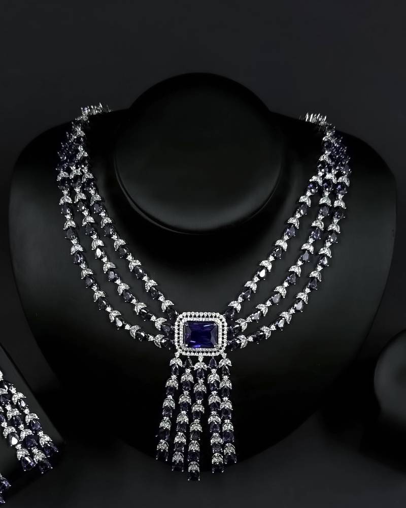 Elegant navy blue accessory set with dangling details