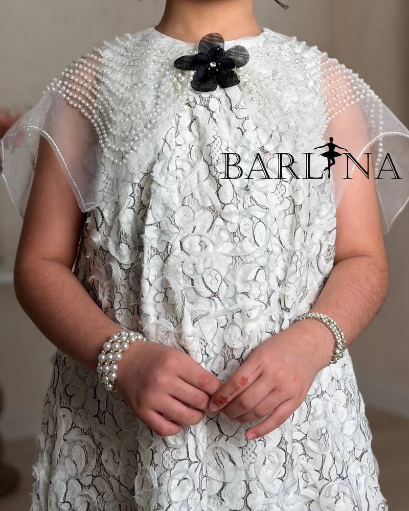 White lace girl's dress with a black rose