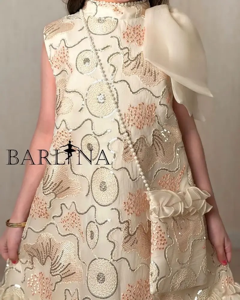 Girls' embroidered dress with ruffles at the bottom