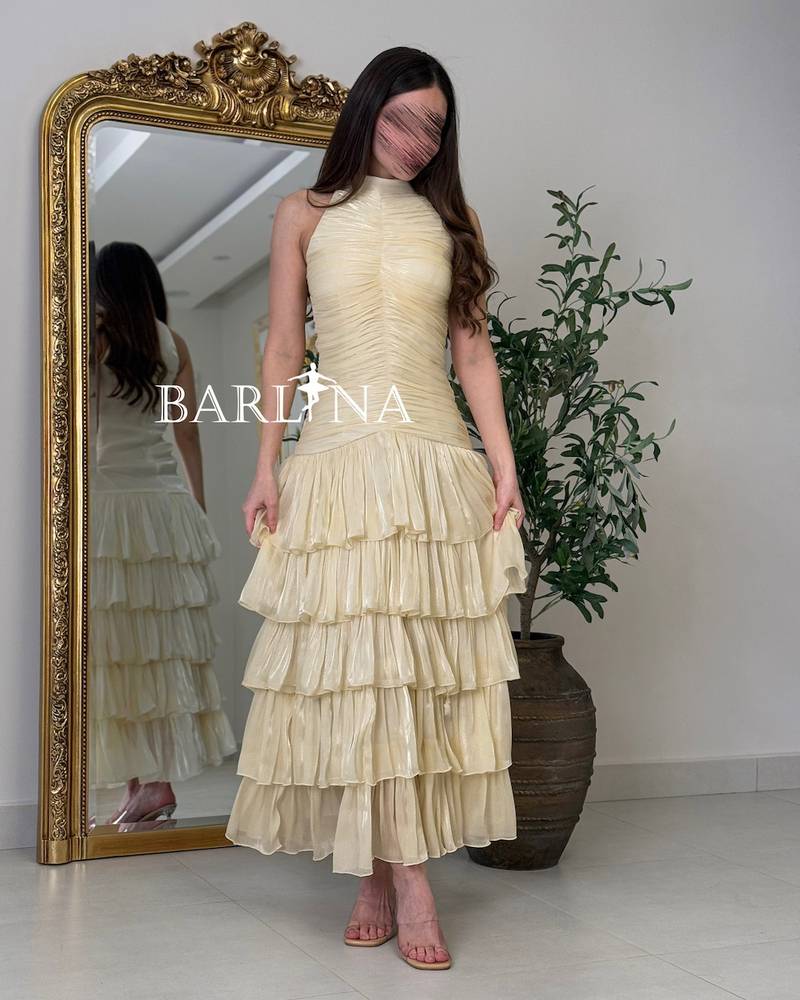 Beige dress with tiered flared skirts