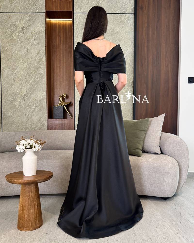 Black evening dress with a tail in the back