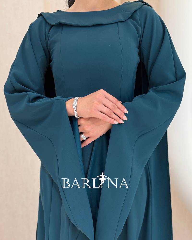 Petrol blue dress with a wide design and loose sleeves