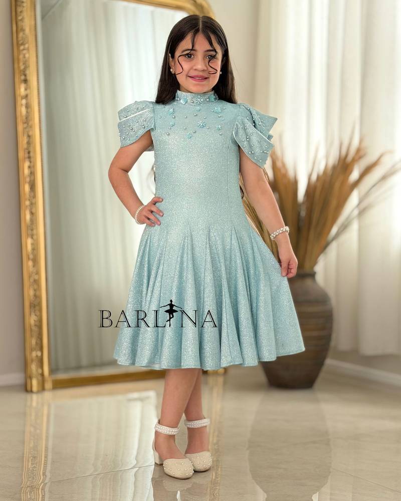 A sparkly girl's dress decorated with pearls