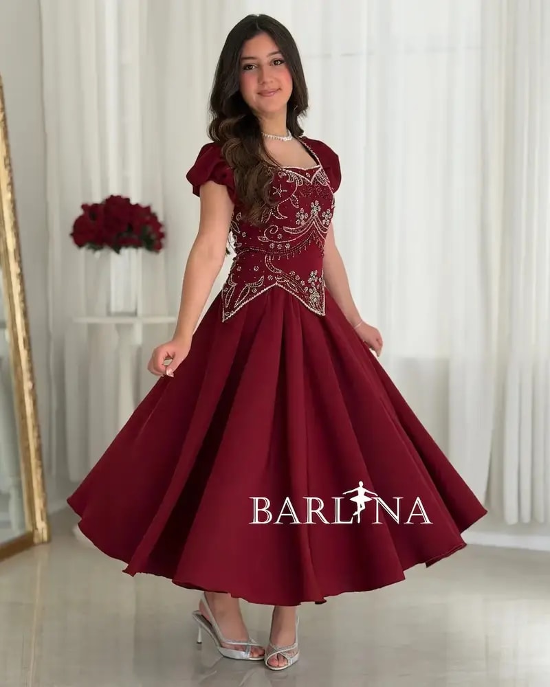 A flowing red dress with elegant beadwork