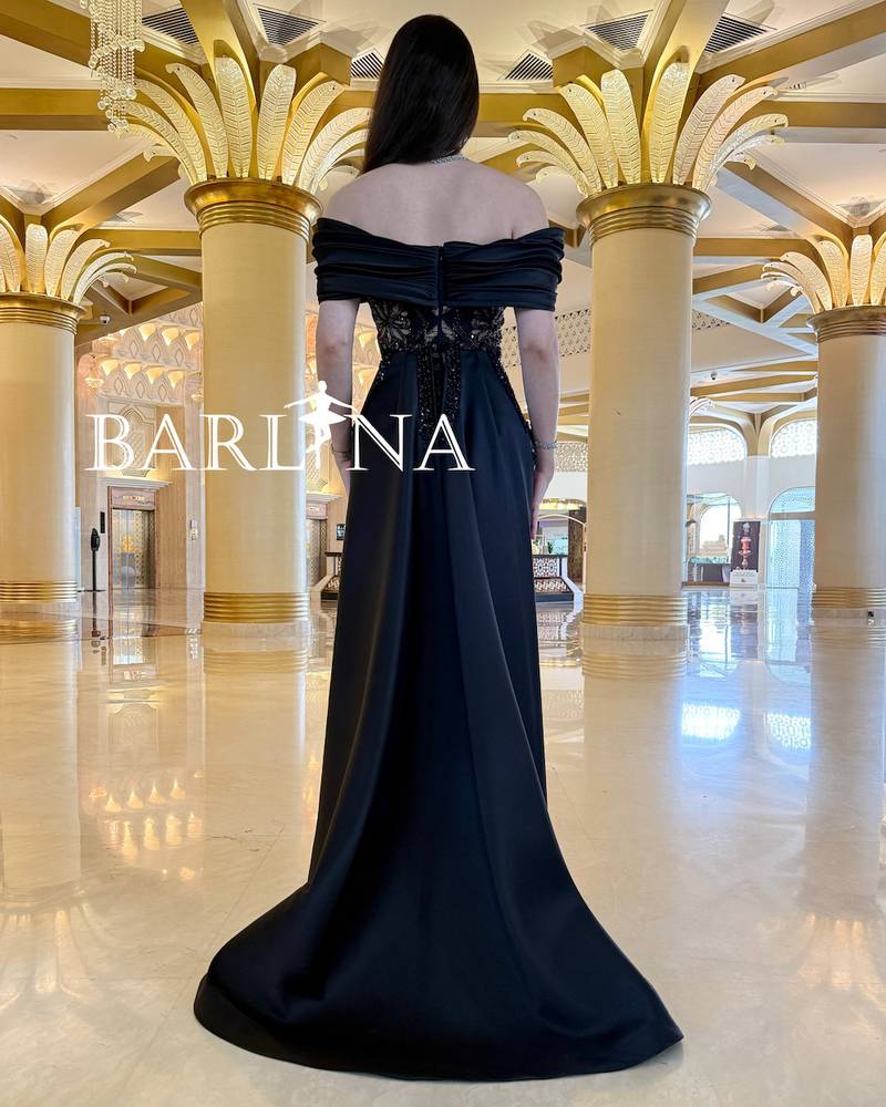Black dress with shiny embroidery in geometric designs