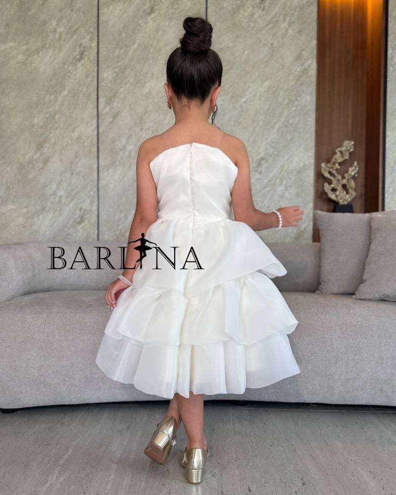 Off-white girls' dress with a large flower on the chest