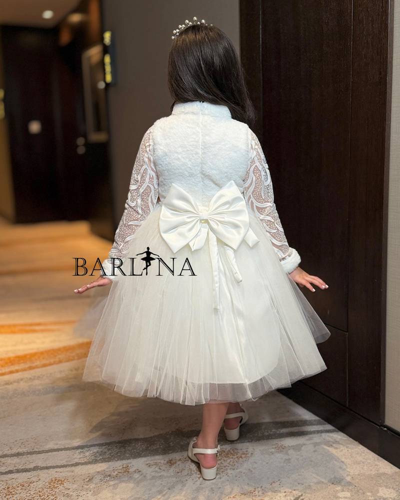 White girl's dress with a high neck and fluffy tulle