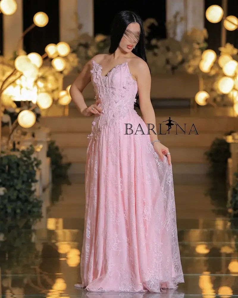 Pink evening dress embroidered with delicate lace